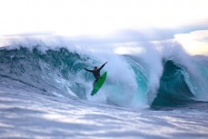 Dan Smith takes flight on a slabbing reefbreak in the South Island, New Zealand.