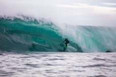 Dave Lyons deep inside a slabbing reefbreak in the South Island, New Zealand.