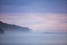 Headlands in the dawn mist at St Clair, Dunedin, New Zealand.