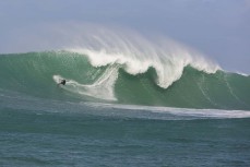 Davy Wooffindin rides a big wave at a remote reefbreak in southern New Zealand surfing the same swell that produced a record 23.8m wave to the south of Stewart Island on May 8, 2018. 