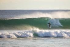 A surfer drops into a nice summer wave at St Kilda, Dunedin, New Zealand.
Credit: www.boxoflight.com/Derek Morrison