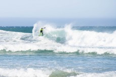 Luke Rogers makes the most of fun offshore summer waves at Blackhead, Dunedin, New Zealand.