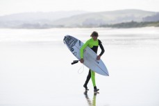 Luke Rogers makes the most of fun offshore summer waves at Blackhead, Dunedin, New Zealand.