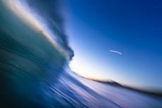 A wave breaks on dusk at Blackhead, Dunedin, New Zealand.