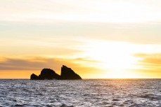 The entrance to Doubtful Sound on dusk during a Heritage Expeditions voyage to Doubtful Sound, Fiordland, New Zealand.