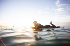 Rewa all smiles in fun summer waves at St Clair Beach, Dunedin, New Zealand. 