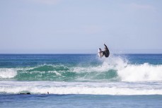 Sunshine Coast surfer Byron Massey takes flight during a small summer swell at Blackhead, Dunedin, New Zealand. 