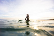 Keo Morrison waiting for a set during a small summer swell at Blackhead, Dunedin, New Zealand. 