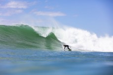 Rob Bennett, of Mangawhai, bottom turns on a large swell near Dunedin, New Zealand.