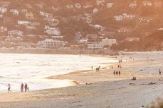 Beach walkers on dusk at St Clair, Dunedin, New Zealand.
Credit: www.boxoflight.com/Derek Morrison