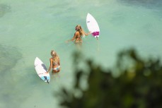 The girls paddling out from the cave at Uluwatu, Bali, Indonesia.