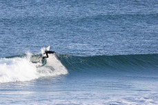 A surfer makes the most of conditions at Blackhead, Dunedin, New Zealand.