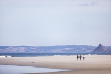 Walkers at Smaills Beach, Dunedin, New Zealand.
Credit: www.boxoflight.com/Derek Morrison