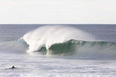 A surfer paddles into clean waves at St Clair, Dunedin, New Zealand.Credit: www.boxoflight.com/Derek Morrison