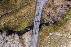 Ultra endurance athlete Glenn Sutton, of Dunedin, crosses Deep Stream during a 104km training run from Dunedin to Middlemarch, New Zealand.