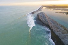 Waves break near the Rangitata Rivermouth, Canterbury, New Zealand.