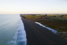 The Ashburton River enters the South Pacific Ocean at the Hakatere east of Ashburton, Canterbury, New Zealand.