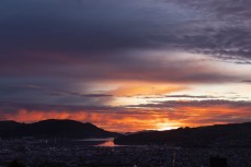 Winter sunrise over Otago Harbour and the city from St Clair, Dunedin, New Zealand.Credit: www.boxoflight.com/Derek Morrison