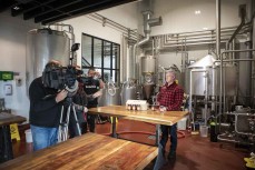 Greg Menzies, of Emersons, is interviewed by TVNZ after making a beer, Into The Valley for Glenn Sutton, of Dunedin, New Zealand, who is  preparing for the Badwater 135, the world's toughest footrace, held through Death Valley, California, in July. 