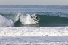 Nick Mills makes the most of fun winter waves at St Kilda, Dunedin, New Zealand.