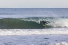 Nick Mills makes the most of fun winter waves at St Kilda, Dunedin, New Zealand.