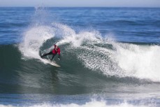 Jai Earnshaw kung fu turn during a Buller vs Kaikoura contest in a fun winter swell at Kaikoura, Canterbury, New Zealand. 