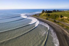 Swell lines wrap into one of New Zealand's most iconic breaks during a fun winter swell at Kaikoura, Canterbury, New Zealand. 