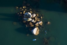 Mischa and Mitch explore Abel Tasman National Park on a stunning day on the water, Tasman, New Zealand.