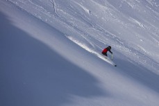 Evan Williams find some powder on a blue bird day at Rainbow Ski Area near Nelson, Tasman, New Zealand.