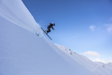 Katie Duffy drops into powder on a blue bird day at Rainbow Ski Area near Nelson, Tasman, New Zealand.