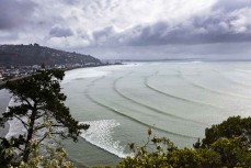 Surfers make the most of waves during a north swell at Christchurch, Canterbury, New Zealand. 