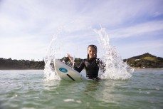 Talia, 11, skips school for some surf coaching at Sandy Bay, Tutukaka Coast, Northland, New Zealand.