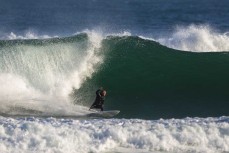 Jeff Patton bottom turns on a wave at Blackhead, Dunedin, New Zealand.
