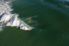 Jamie Civil gets barreled in stormy surf at Blackhead, Dunedin, New Zealand.