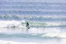 Max Wooffindin, 7, carves up a wave during a warm summery afternoon in fun waves at Aramoana, Dunedin, New Zealand.