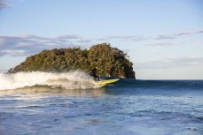 Skip surfs a wave at Mount Maunganui, Bay of Plenty, New Zealand.