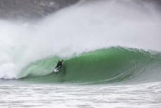 Paul Moretti rides a barrel during a storm swell at a remote beach break in the Catlins, New Zealand.Credit: www.boxoflight.com/Derek Morrison