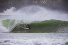 Paul Moretti rides a barrel during a storm swell at a remote beach break in the Catlins, New Zealand.Credit: www.boxoflight.com/Derek Morrison