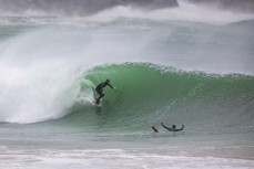 Jarred Hancox rides a tube during a storm swell at a remote beach break in the Catlins, New Zealand.Credit: www.boxoflight.com/Derek Morrison