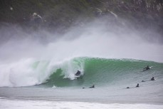 Jamie Civil slides into a wave during a storm swell at a remote beach break in the Catlins, New Zealand.Credit: www.boxoflight.com/Derek Morrison