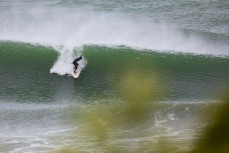 A surfer makes the most of a storm swell at a remote beach break in the Catlins, New Zealand.Credit: www.boxoflight.com/Derek Morrison