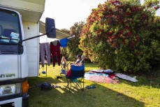 The Gabbot camp in the sunshine at Tauranga Bay, Westport, West Coast, New Zealand.