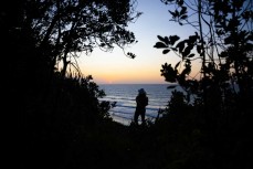Gemma takes in the sunset at Back Beach, New Plymouth, Taranaki, New Zealand.