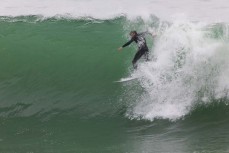 Joe Dirt finding the best nuggets during a fun swell at a beach on the North Coast, Dunedin, New Zealand.Credit: www.boxoflight.com/Derek Morrison