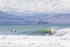 A surfergirl enjoys fun waves at Aramoana, Dunedin, New Zealand.
Credit: www.boxoflight.com/Derek Morrison