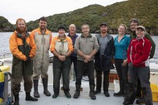 The team on the Southern Winds from left, Charlie, Kevin, Phred, Nick, Chris (skipper), Odin, Heather, Bill and Louise, during a sea lion pup tagging trip to Port Pegasus, Stewart Island, New Zealand.