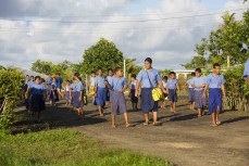 Local school kids collect the rubbish at Salani, Samoa. 