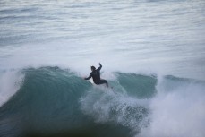 Dane Robertson catches a wave at dusk at St Clair, Dunedin, New Zealand.
Credit: www.boxoflight.com/Derek Morrison