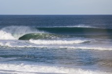 A big swell hits a remote break near Dunedin, New Zealand.Credit: www.boxoflight.com/Derek Morrison