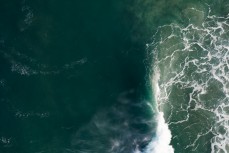 A big swell hits a remote break near Dunedin, New Zealand.Credit: www.boxoflight.com/Derek Morrison